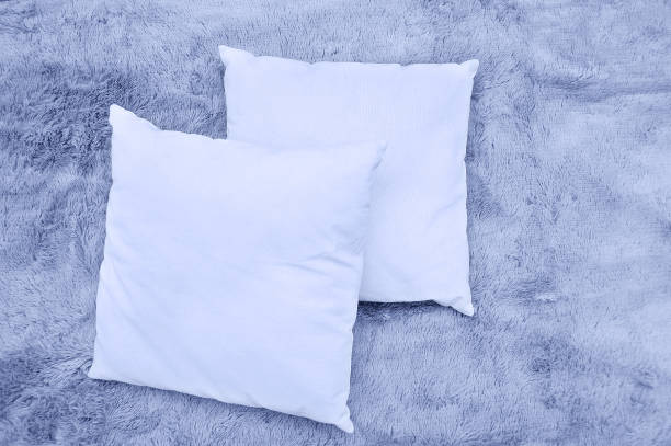 istock Gray fur blanket and decorative small pillows close-up. Home textiles. 1263936252