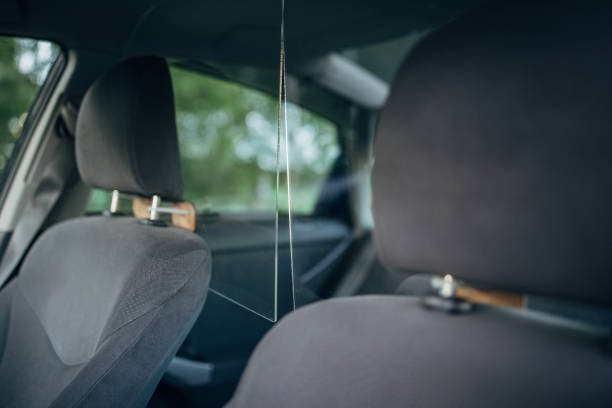 istock Interior of a taxi car with plastic divider between front and back seats 1263936747