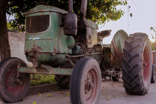 Low angle view of  a big old tractor parked on the streets of small rural town called Laborde in Cordoba Argentina