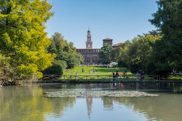 people enjoying in the parco sempione (sempione park) at milan city, italy. - milan italy italy castello sforzesco color image imagens e fotografias de stock