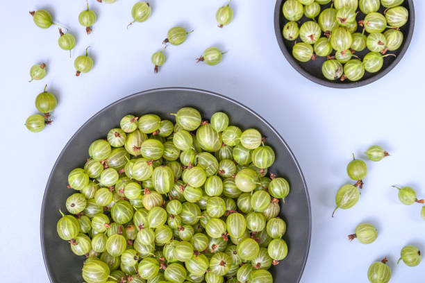 istock Green gooseberry isolated on white background 1263937913