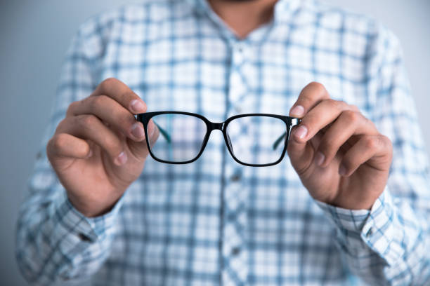 istock man hand holding glasses 1263940658