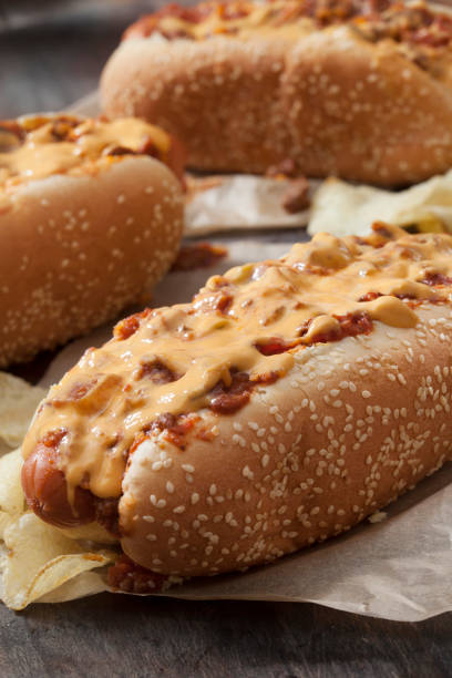 istock Chili Dog with Cheese Sauce and Potato Chips 1263942337