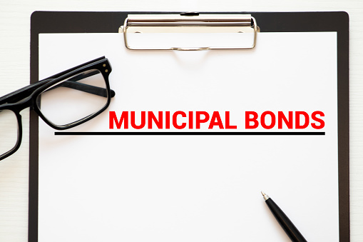 Page of newspaper with words municipal bonds. Trading concept.