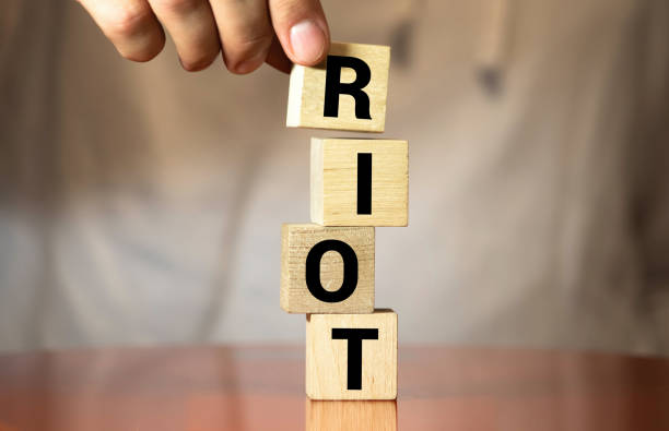 istock RIOT word made with building blocks isolated on white 1263948144