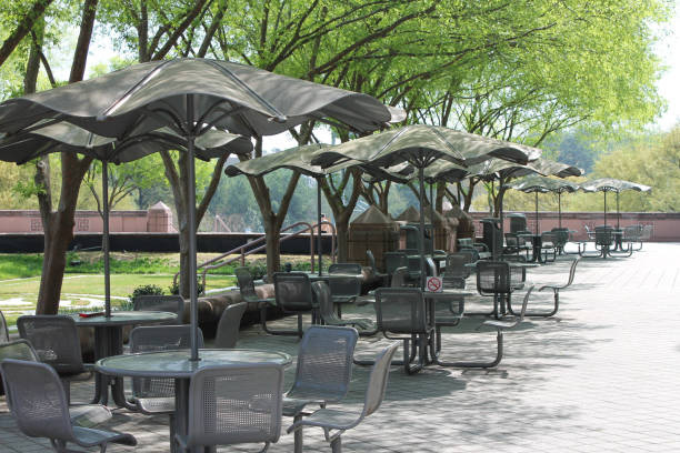 istock Metal table and chairs with umbrellas 1263954750