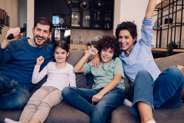 istock Family having fun with TV 1263965511