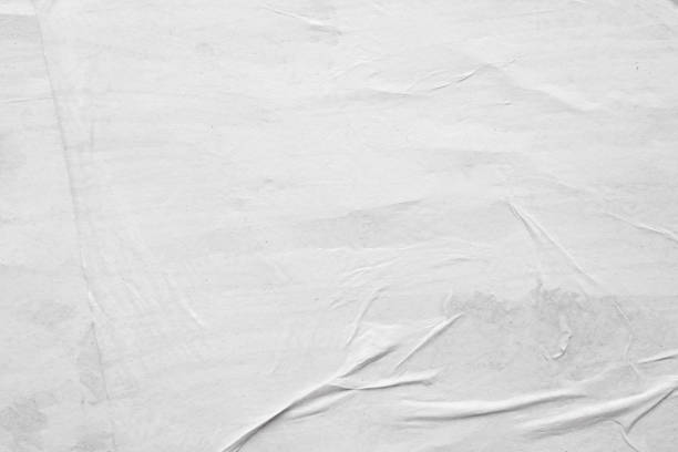 istock Blank white crumpled and creased paper poster texture background 1263965544