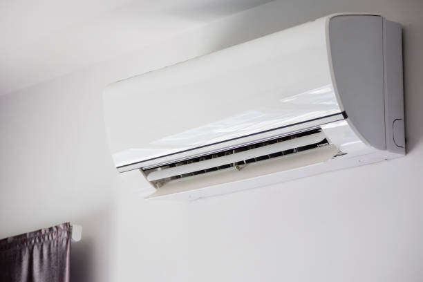 istock Air conditioner on white wall room interior background 1263965817