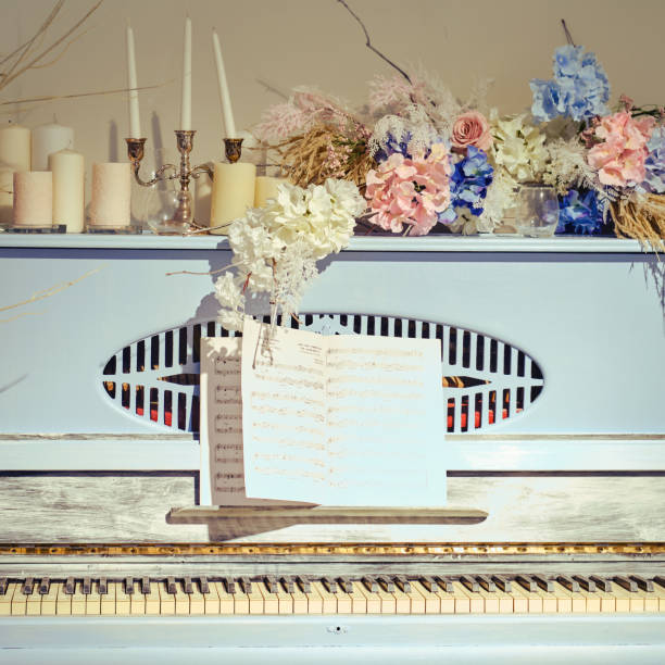 istock Blue retro piano keys with notes on the stand, close-up 1263965962
