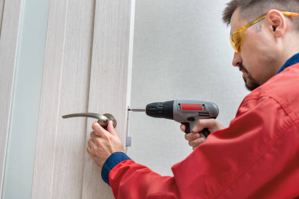 istock Worker installing or repairing the doorknob 1263966426
