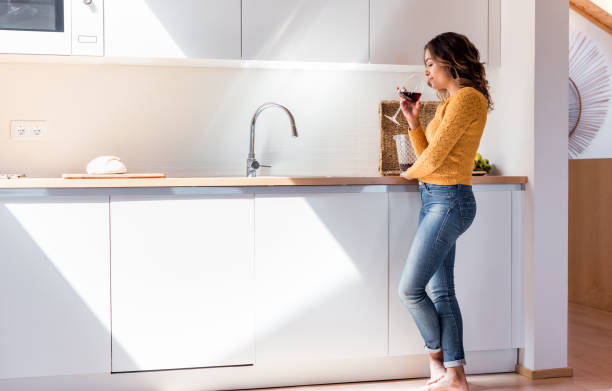 istock Beautiful woman drinking wine 1263972030