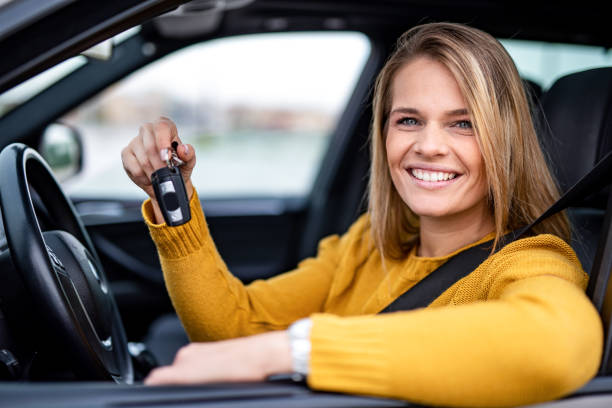 istock Happy young woman bought a new car. 1263973781