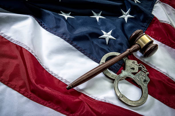 istock Handcuffs and Gavel on American Flag Background 1263975833