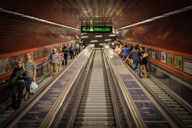 Ascending the escalators in Budapest's old underground metro stock photo