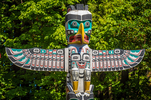 Vancouver, Canada - July 27th 2017: Close up of an eagle themed Totem Pole in Stanley Park, Vancouver, British Columbia, Canada