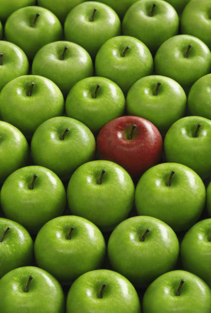 istock Red apple amongst green apples 1263985627