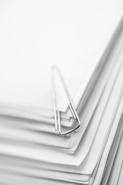 istock Paper clip on a stack of papers 1263986602