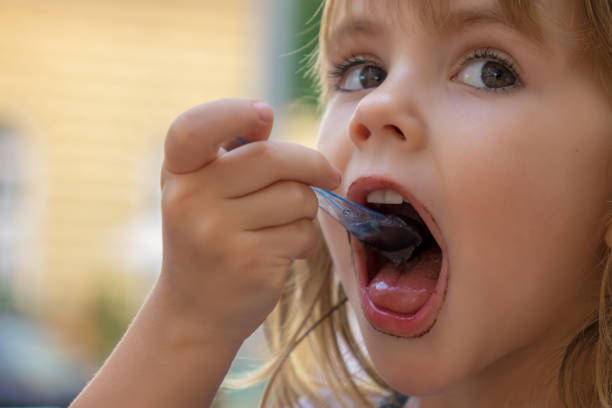 istock little girl eating ice cream 1263987676