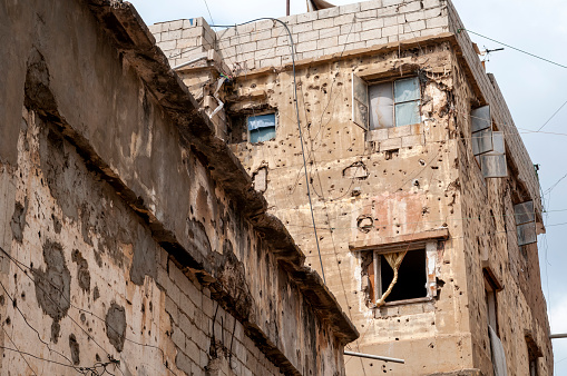 War-damaged apartment building in the Sabra and Shatila refugee camps in south Beirut, Lebanon. The camp was established for Palestinians in 1949.