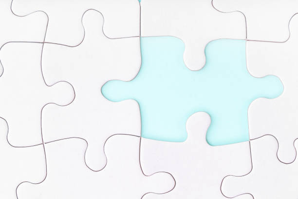 istock Missing piece of jigsaw puzzle on blue background. Completing final task. Looking for men male. 1263992329