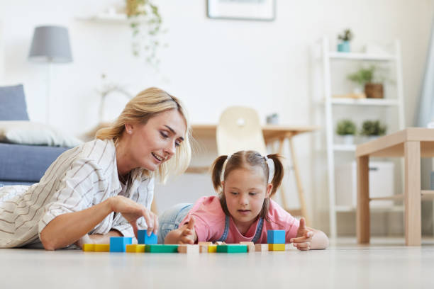 istock Mother playing with daughter in toys 1263995666