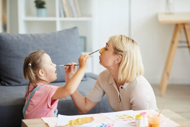 istock Family painting each other 1263995685