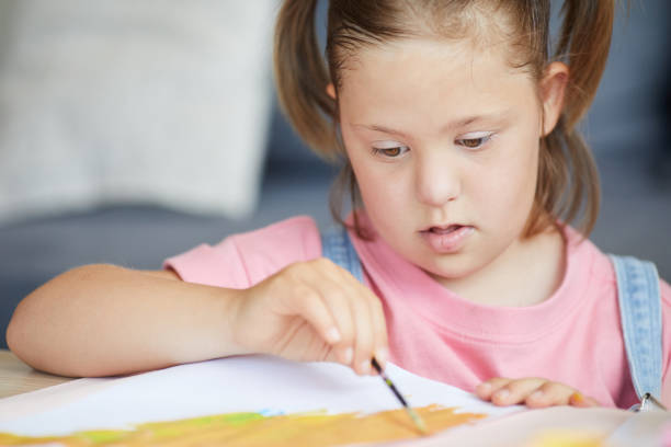 istock Disabled child painting 1263995758
