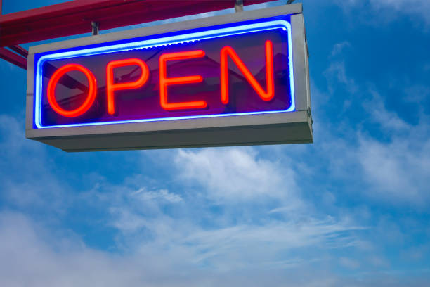 istock open neon sign red and lue on sky background 1263998108