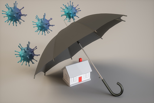 Stay Home Concetps. Umbrella Protecting A House.