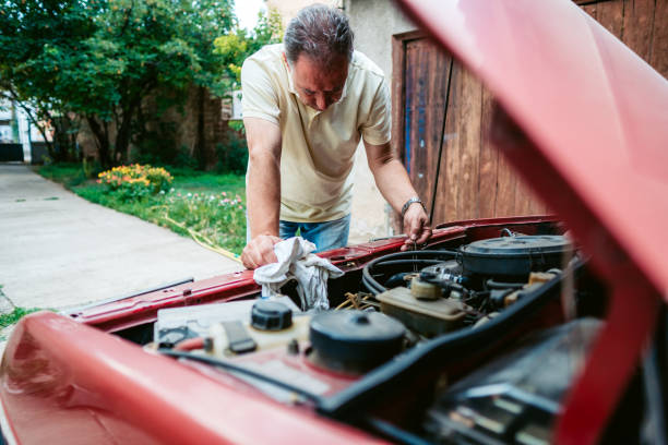 istock Senior man repairing car 1263999883