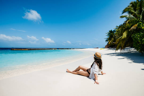 istock Attractive woman on beach 1264000227
