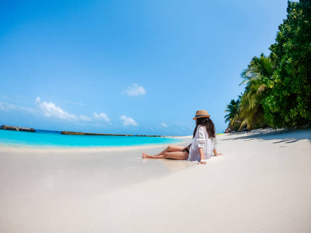 istock Attractive woman on beach 1264000255