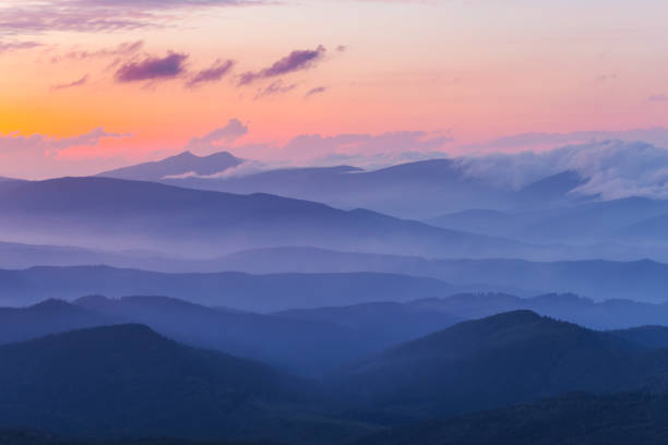 istock evening mountain valley in a blue mist 1264001127