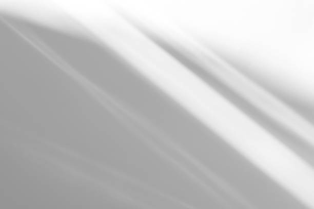 istock diagonal shadow and rays of light on a white background 1264005952