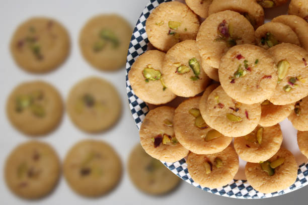 Sweet milk peda with pistachio garnishing is Traditional Indian sweet. Traditional Indian sweet made during festival like Diwali,durga puja with milk or khoya and garnished with dry fruits. rajkot india stock pictures, royalty-free photos & images