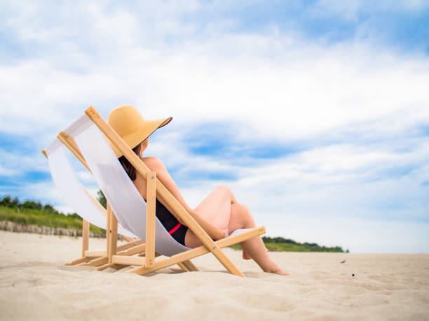 istock Woman relaxing on beach 1264007382