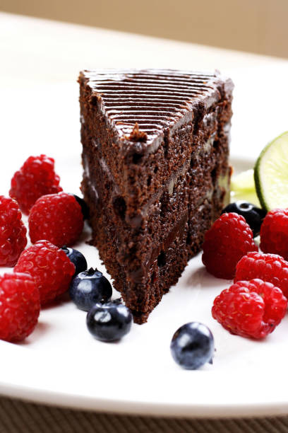 istock Chocolate cake and berries on a plate 1264008733
