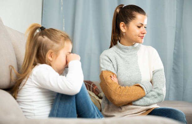 istock Woman having communication conflict with small daughter crying 1264009642