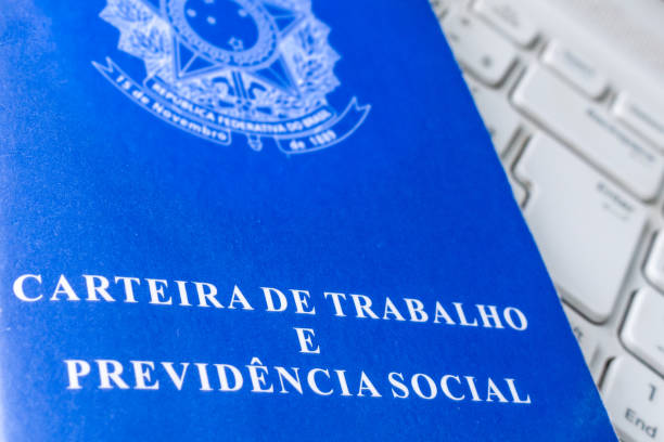 istock Looking for a job on the Internet. Brazilian work card on computer. 1264013118