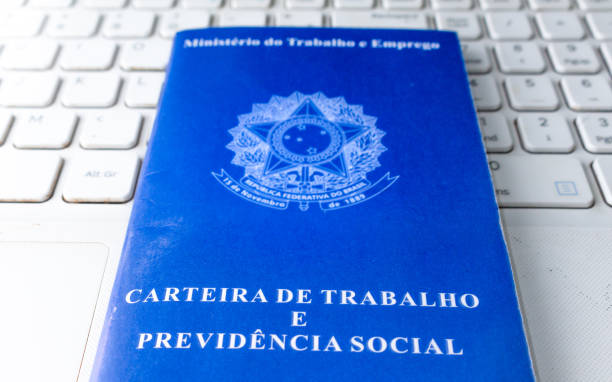 istock Looking for a job on the Internet. Brazilian work card on computer. 1264013123