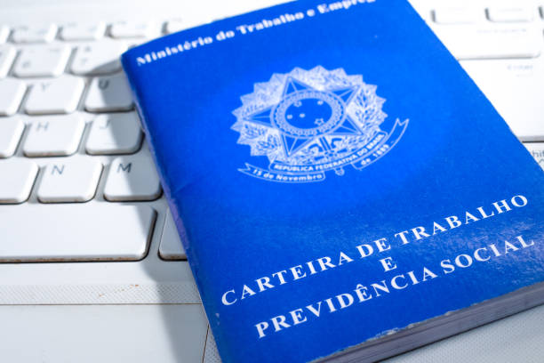 istock Looking for a job on the Internet. Brazilian work card on computer. 1264013125
