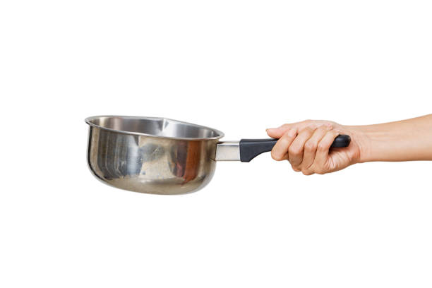 istock Woman holding saucepan for cooking classes on white 1264013258