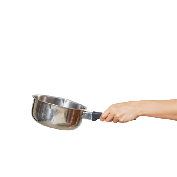 istock Woman holding saucepan for cooking classes on white 1264013266