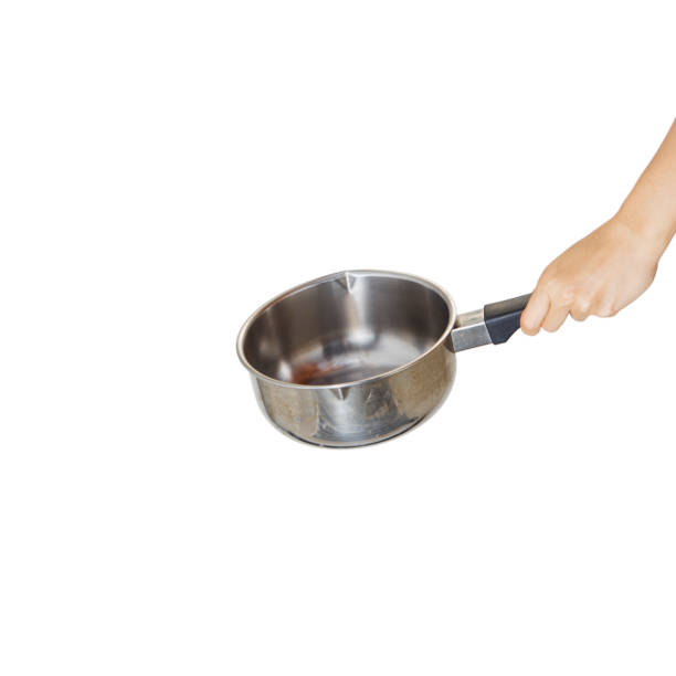 istock Woman holding saucepan for cooking classes on white 1264013945