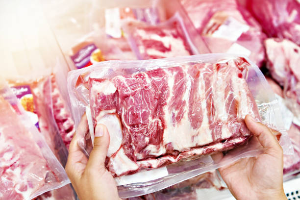 istock Hands with pork ribs in shop 1264019623