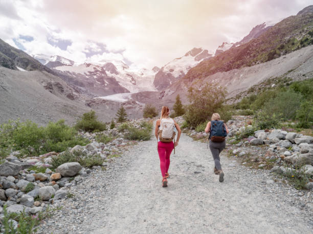 istock Two hiking women on mountain trail 1264021770