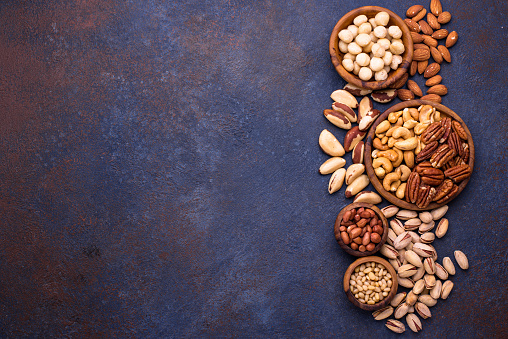 Assortment of various nuts. Almonds, pecan, macadamia, pistachio, and cashew
