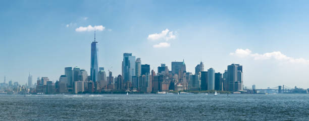 istock Panorama manhattan skyline from hudson river with blue sky and summer cloud from liberty island. New York, United States. 1264035512