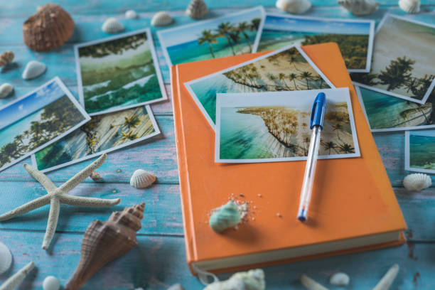 istock Close up of tropical postcards, notebook, seashells and starfish 1264046248
